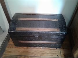 Dome pressed tin and wood steamer trunk