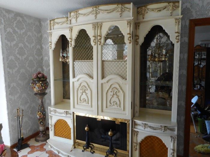 3 Pieces. Open Curio with Chandeliers Smoky Glass. Glass Shelves. Hand Carved Italian Provincial . Needs re wiring. Fireplace, Glow Logs. Middle Opens Lighted.
