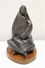 Allan Houser (American, 1914-1994)
Size (h w d): 10 x 5.75 x 6.75 in
Medium: Bronze
Subject Matter: Figural
Type: Sculpture
One cast bronze sculpture depicting a seated woman with an infant in her arms. The sculpture is mounted on a round wood base.
Circa: 20th century 
Inscriptions: Incused signature above stamped numerals "7.20" on figure's left side.
