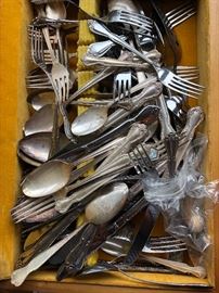 Several partial sets of flatware and lots of assorted serving pieces/ Great to complete a set or for craft projects.