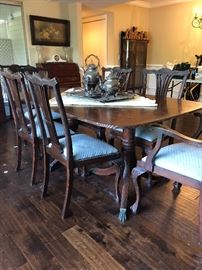 Antique Chippendale dining room table 8 chairs including two captains chairs, three leaves