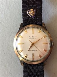 Vintage Marc Nicolet man's wristwatch with woven band. A gold Masonic emblem attached to band. 