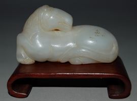 Carved jade horse on stand
