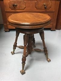 Antique stool with glass ball and claw feet