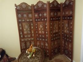 Carved folding screen. Teak wood with inlay.