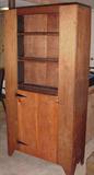 Wonderul primitive cupboard with three shelves and a door below.  Wide board construction
