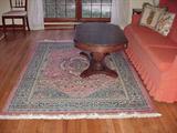 Oriental rug, pedestal coffee table with hidden drawer