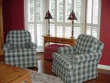 Club chairs upholstered in a checked fabric