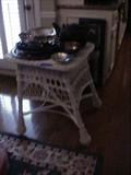 Wicker table and lots of silverplated serving pieces
