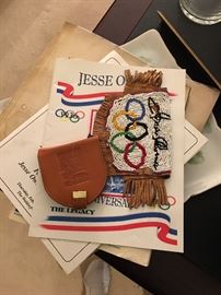 Olympic memorabilia. COA available. Coca Cola endorsed Olympic endorsements. Hand beaded Indian pouch for namesake. 