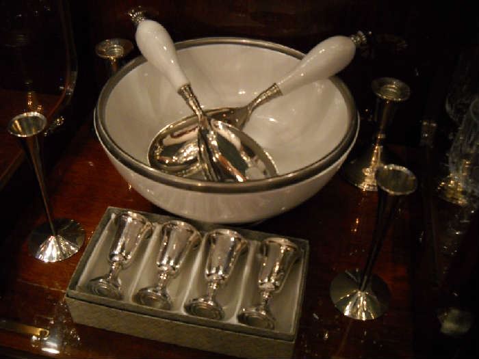Silver-rimmed salad bowl and utensils