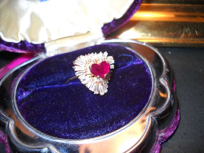  14K gold ring with 2 carat heart-shaped ruby surrounded by diamonds
