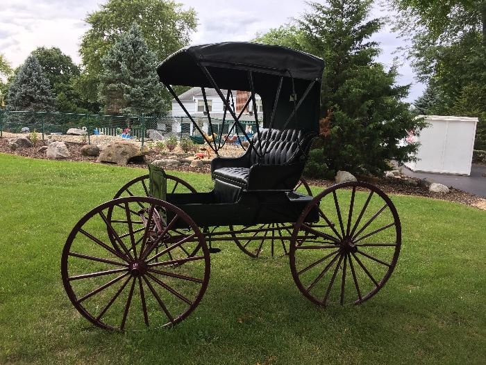 Antique horse drawn buggy with seat for 2