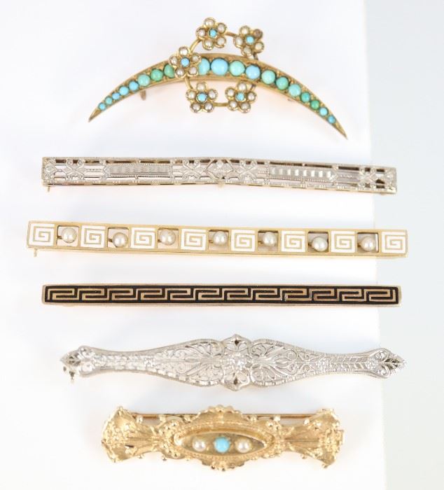 A Group of Six 19th & Early 20th Century Bar Pins & Brooches - Including 4 14 kt yellow and white gold bar pins, of various designs including filigree, enamel, seed pearls, and turquoise, all marked, together with 1 Victorian 14 kt yellow gold, seed pearl, and turquoise brooch, stamped "14K", and 1 Victorian crescent shaped brooch with floriform accents, decorated with turquoise and seed pearls, unmarked.  Minor wear overall, the crescent brooch has one seed pearl missing, the other Victorian brooch is slightly misshapen at the sides.  Up to 2 5/8" long.  Totaling 26.0 grams.