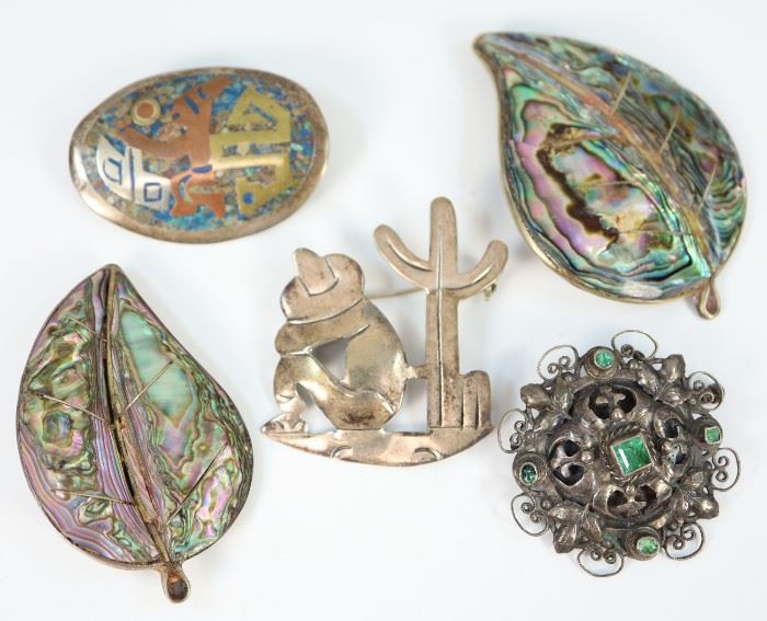 Five Silver Brooches. Including four made in Mexico, two of which inset with abalone and another mixed metal and turquoise, as well as one Eastern European, possibly Russian, marked both "84" and "800". Minor wear. Up to 2 1/2" wide. 
