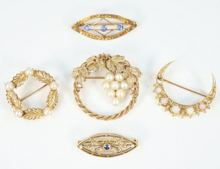 Five Yellow Gold, Pearl, Opal, and Gemstone Brooches -  Including 2 of circular form with pearl accents, 1 crescent form with opals, and 2 of pointed oval form, each with blue gemstones.  Four are stamped "14K", the other, with three blue gemstones, is marked on the closure, possibly "CH".  Minor wear to each.  Up to 1 1/4" diameter.  Totaling 17.8 grams.  
