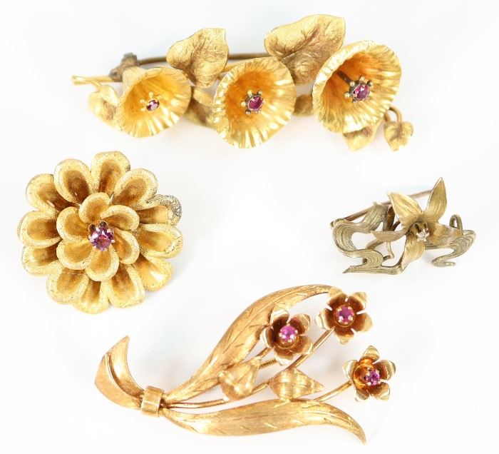 Four Gold & Gemstone Clad Brooches -  Including one 18 kt yellow gold flower bouquet form brooch with rubies, stamped "18K Italy Pavi", together with three other unmarked gold tone floriform brooches each enhanced by various gemstones.  Wear to each, two of the unmarked pieces with solder evident at the closures.  Up to 2.25" long.  Totaling 22.2 grams.  
