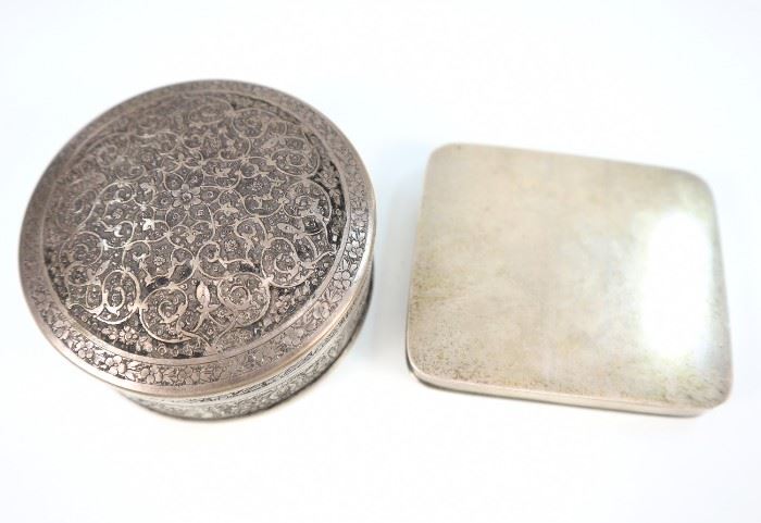 An American Sterling Box & a Persian Silver Box -  Consisting of 1 simple sterling box with fitted interior stamped with Arthur Stone maker's mark and "Sterling" together with 1 round Persian .875 silver box stamped with standard "84" and two other markings.  Some wear and light scratches to each.  Totaling 7.16 troy oz.  3" in width and diameter.  
