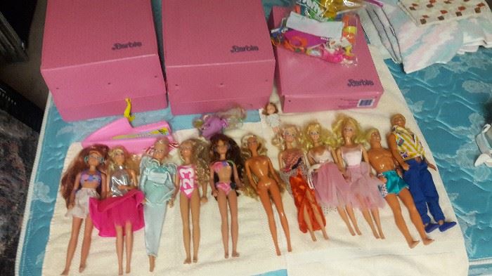 barbie dolls , carry cases