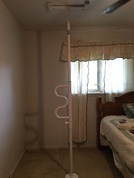 Floor to ceiling handicap pole to help getting out of bed.