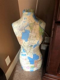 Mannequin body wrapped in map of New Orleans