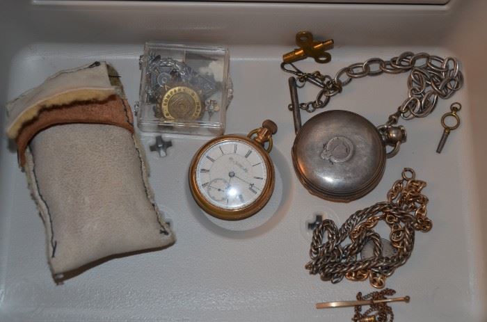 gold pocket watch, silver pocket watch