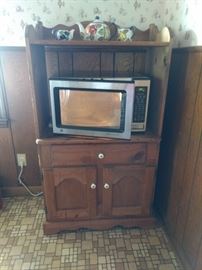 Microwave
Large enough for a big bowl.  Turntable does not turn$25. Pine stand $100.