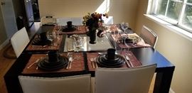 High end Black dining table with White leather chairs