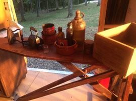 Wooden ironing boards with irons, old judge coffee advertising, old crocks, many old crates with advertising 