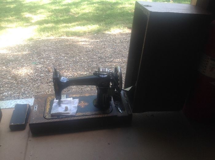 Antique sewing machine in case with original paperwork