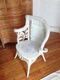 Unique wicker chair has an unusual shape.