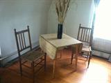 The drop leaf table creates space when you need it and a large table when you don't.