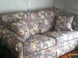 A couch that is just perfect for your sunroom, living room or enclosed porch.