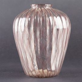 Lot #56 Lino Tagliapietra (b. 1934). Squat baluster glass vase with ribbed body. Transparent glass with thin purple filaments forming a checked pattern. 
Provenance: Directly from artist
Collection of Edward Claycomb. 
Dimensions: Height: 7 1/2 in x diameter: 6 in.