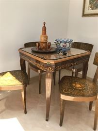 Venetian inlaid wood game table with four chairs. 