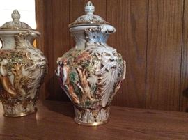 Look at the detail under the handles of these urns