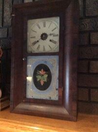 Janome Clock with Brass Weights.  Metal face, Key.  Needs to be repaired.  Pendulum makes a great sound