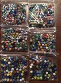 Bags of marbles .  Each bag is being sold as a bag.  No individual marble sales.