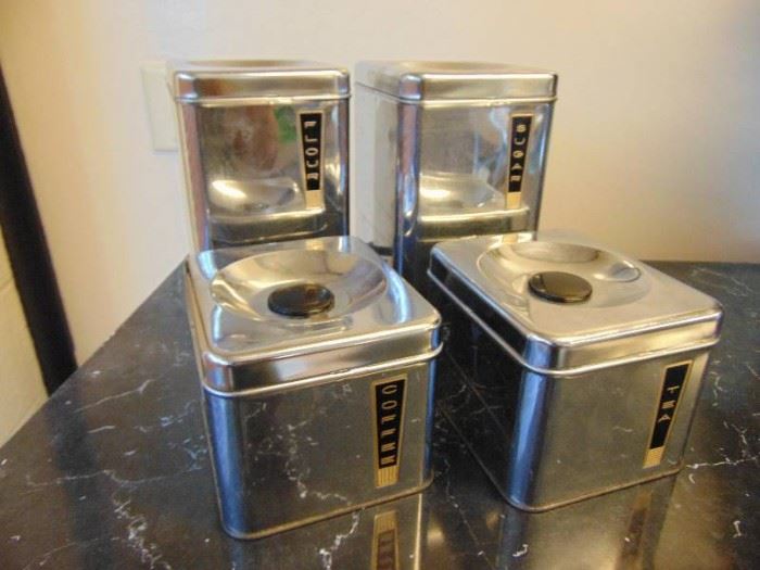4 Metal canisters.