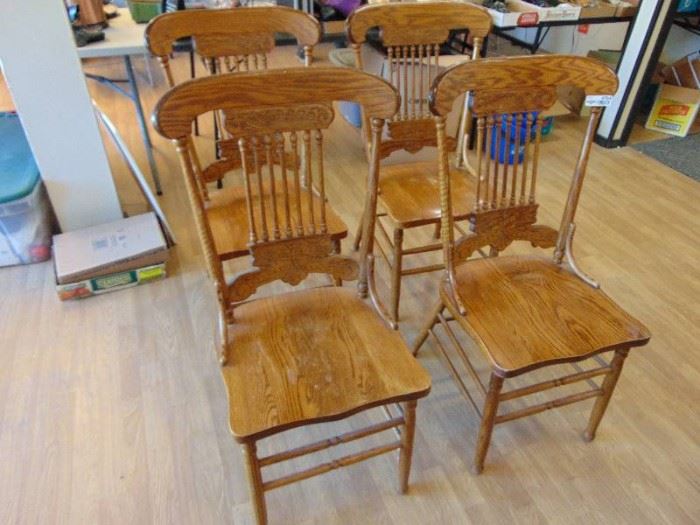 4 Nice wood press back dining chairs.