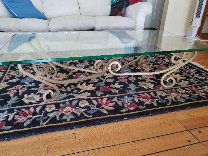Coffee table, cast iron base. 60"x30"x151/2". Glass is 3/4" thick