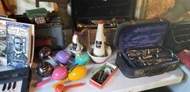Vintage musical instruments, trumpet, clarinet, accordian, electric piano, castinets, horn mutes