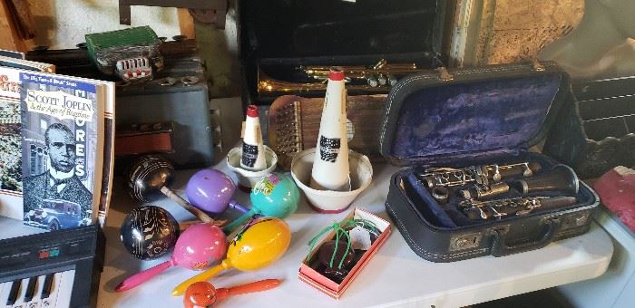 Vintage musical instruments, trumpet, clarinet, accordian, electric piano, castinets, horn mutes