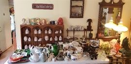 Vintage bisque doll heads, head vases, KLR airline liquor house bottles, ashtrays, dozens of pitchers