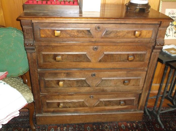Walnut Renaissance Revival four drawer chest