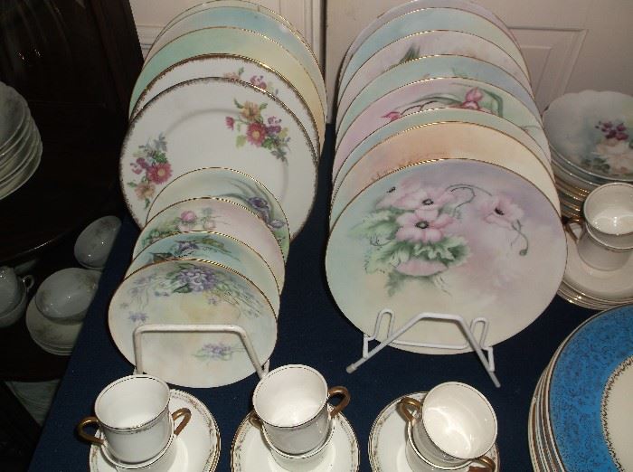 Hand painted china and demitasse cups and saucers