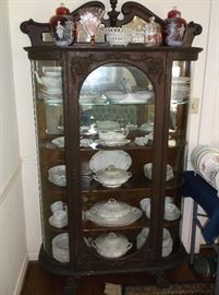 Ornate oak curved glass china cabinet