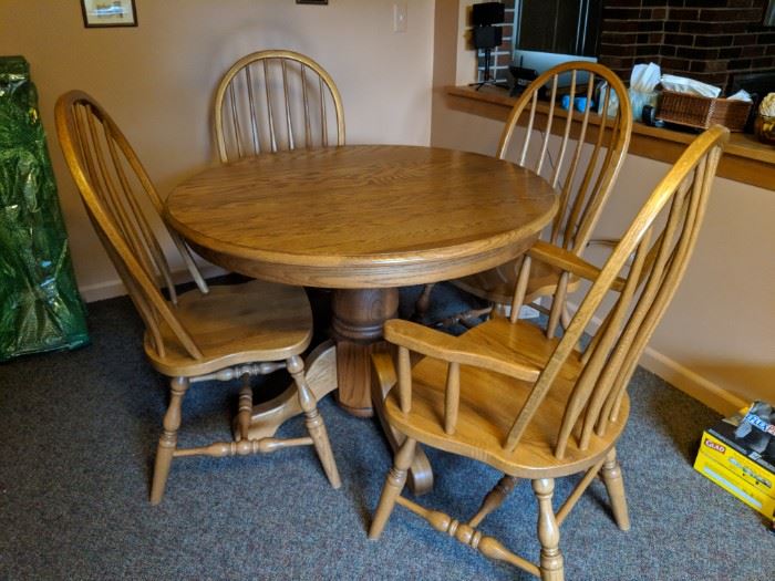 $275   Round oak table with chairs and 2 leaves