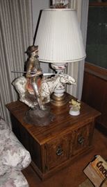The side table, statue, and lamp are included in the sale.  