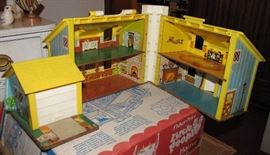 This is the same vintage Fisher-Price house, opened.  It always bothered me that there was no stairs.  How did the people get to the second floor?  Of course, they had no legs, so maybe it didn't matter?
